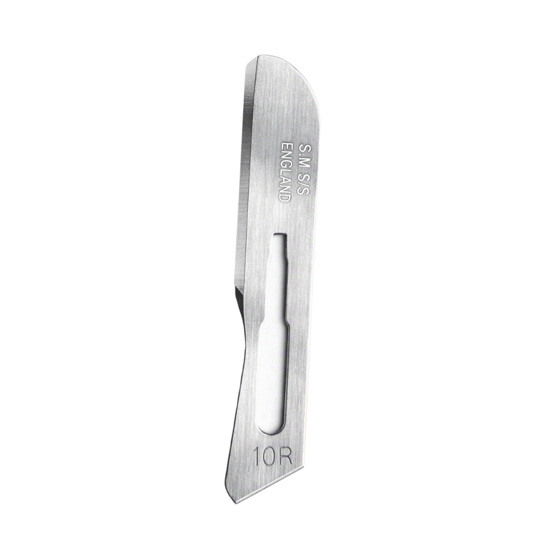 A single stainless steel Swann Morton replacement blade for facial dermaplaning, featuring engraved markings 'SM+S ENGLAND' and '10R' on a plain white background.