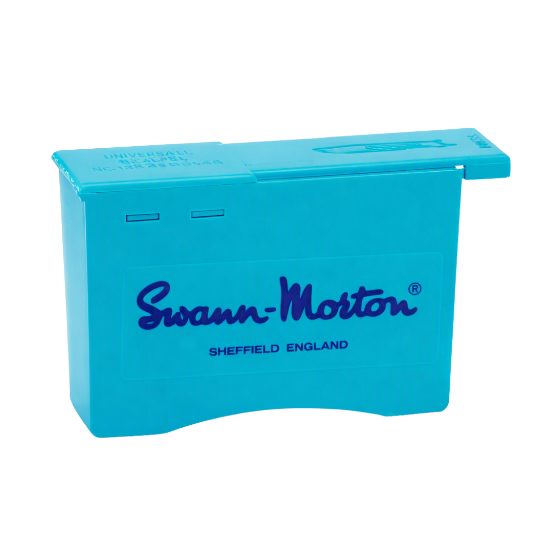 A bright blue plastic Swann-Morton scalpel blade remover box with dark blue branding and 'SHEFFIELD ENGLAND' text, shown on a plain white background.
