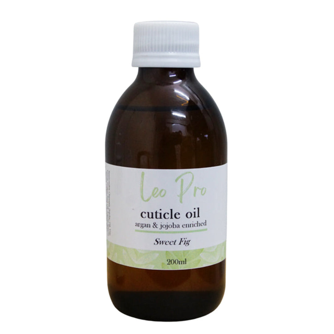 An amber glass bottle of Leo Pro Sweet Fig cuticle oil with a white cap and a white label, shown against a plain white background.