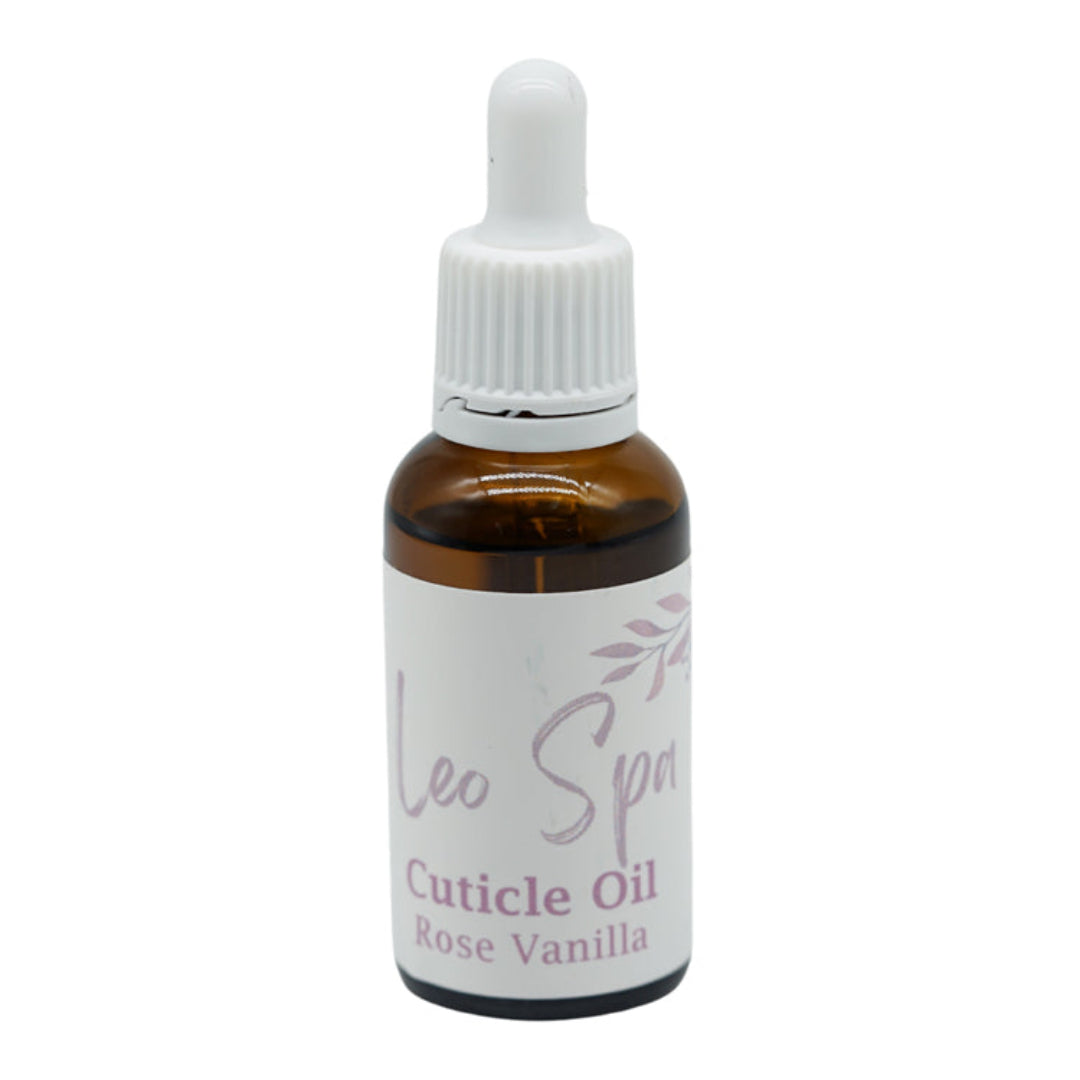 A small amber glass dropper bottle of Leo Spa Cuticle Oil in Rose Vanilla scent, featuring a white label and a white ribbed dropper cap, set against a plain white background.