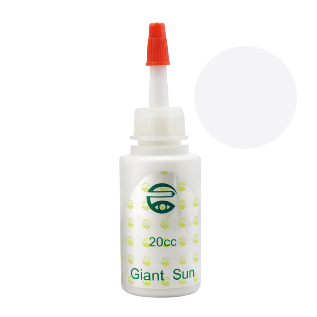 A 20cc bottle of Giant Sun pigment permanent makeup ink with a white body, green printed logo and text, and an orange-red dropper cap, shown against a plain white background with a light gray circular overlay.
