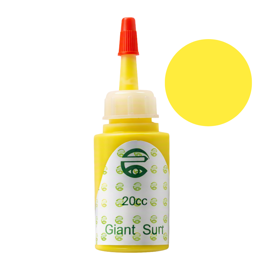 A yellow bottle of Giant Sun pigment permanent makeup ink with a red nozzle cap and a white label, shown on a white background with a large yellow color swatch circle overlay.