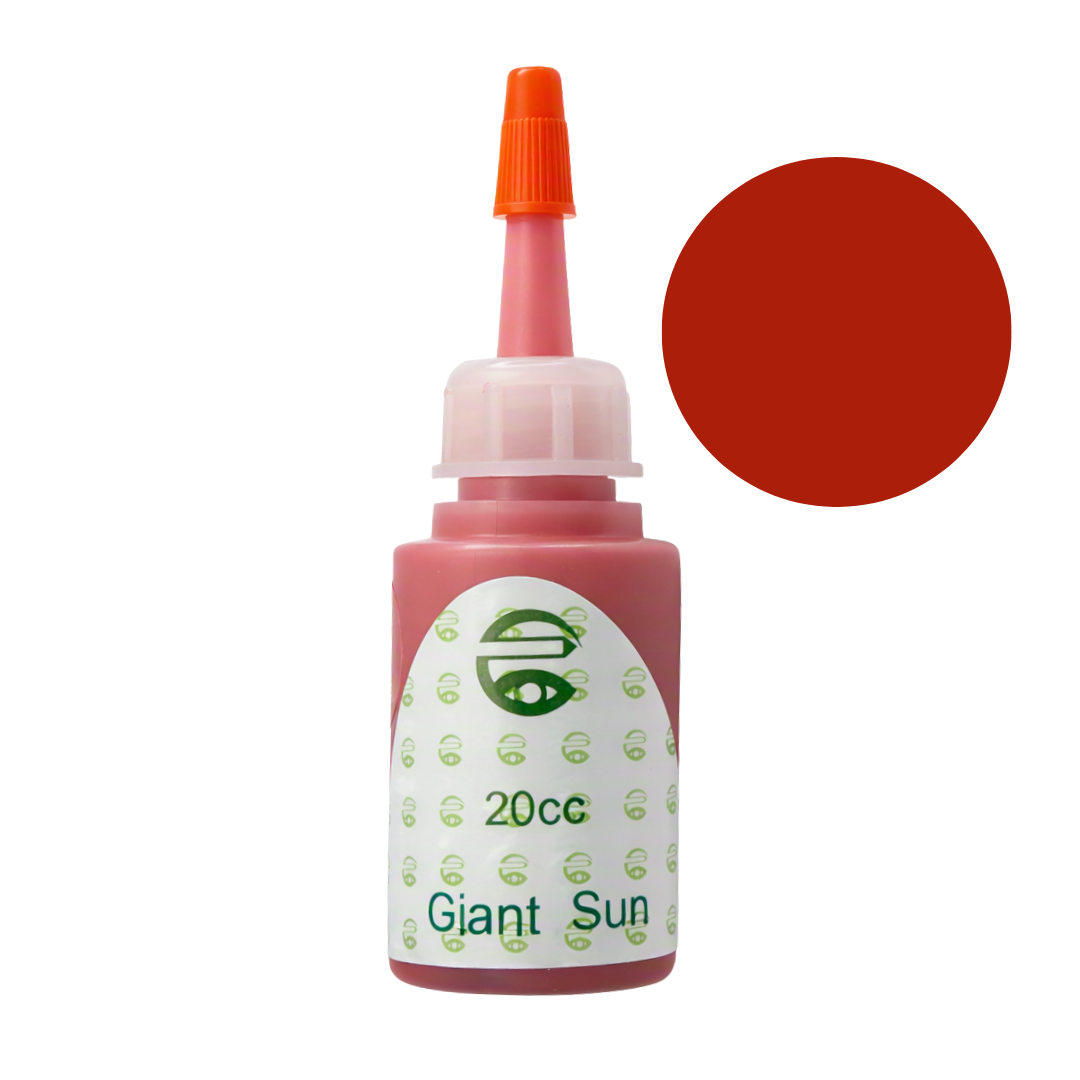 A 20cc bottle of Giant Sun red pigment permanent makeup ink with an orange cap, shown next to a solid red color swatch on a white background.