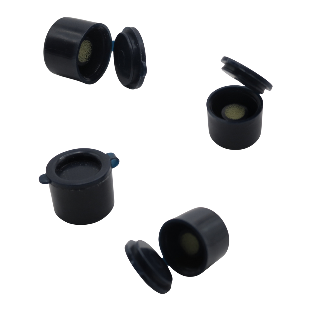 Five black cylindrical plastic pigment mixing pots with hinged lids, shown from different angles on a plain white background.