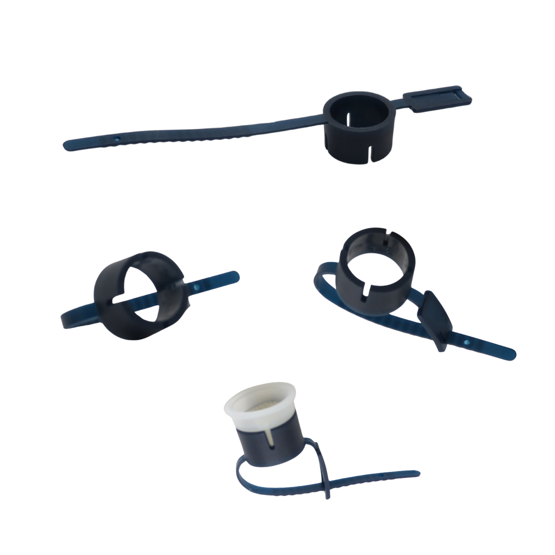 Four dark blue plastic pigment rings with black plastic locking rings, shown on a plain white background.