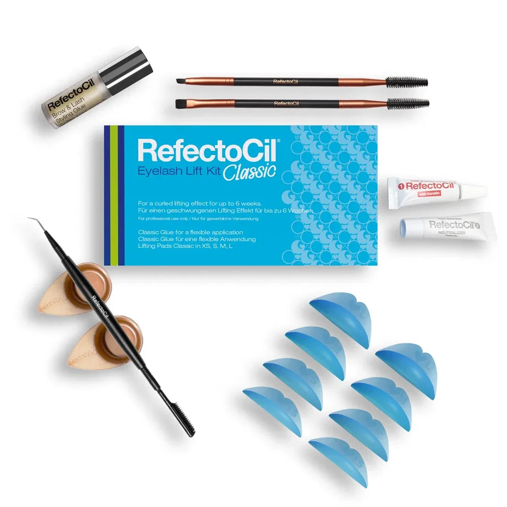 RefectoCil Eyebrow Lift Kit Classic set arranged on a white background, including a blue product box, two eyebrow brushes, a brow lamination glue, two small tubes, a spoolie, and multiple blue lifting pads.