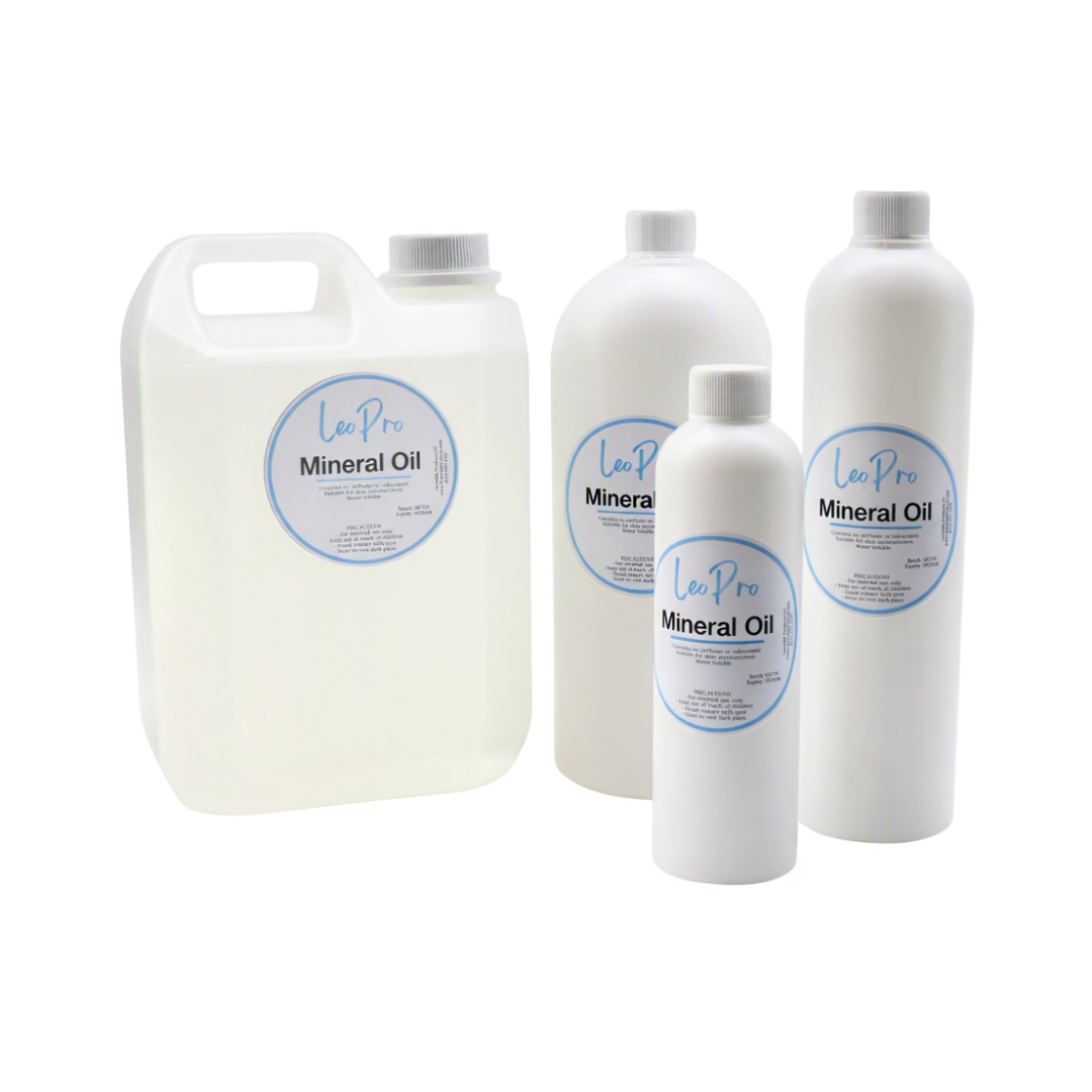 A collection of mineral oil, also known as technical oil, in various size plastic bottles on a white background