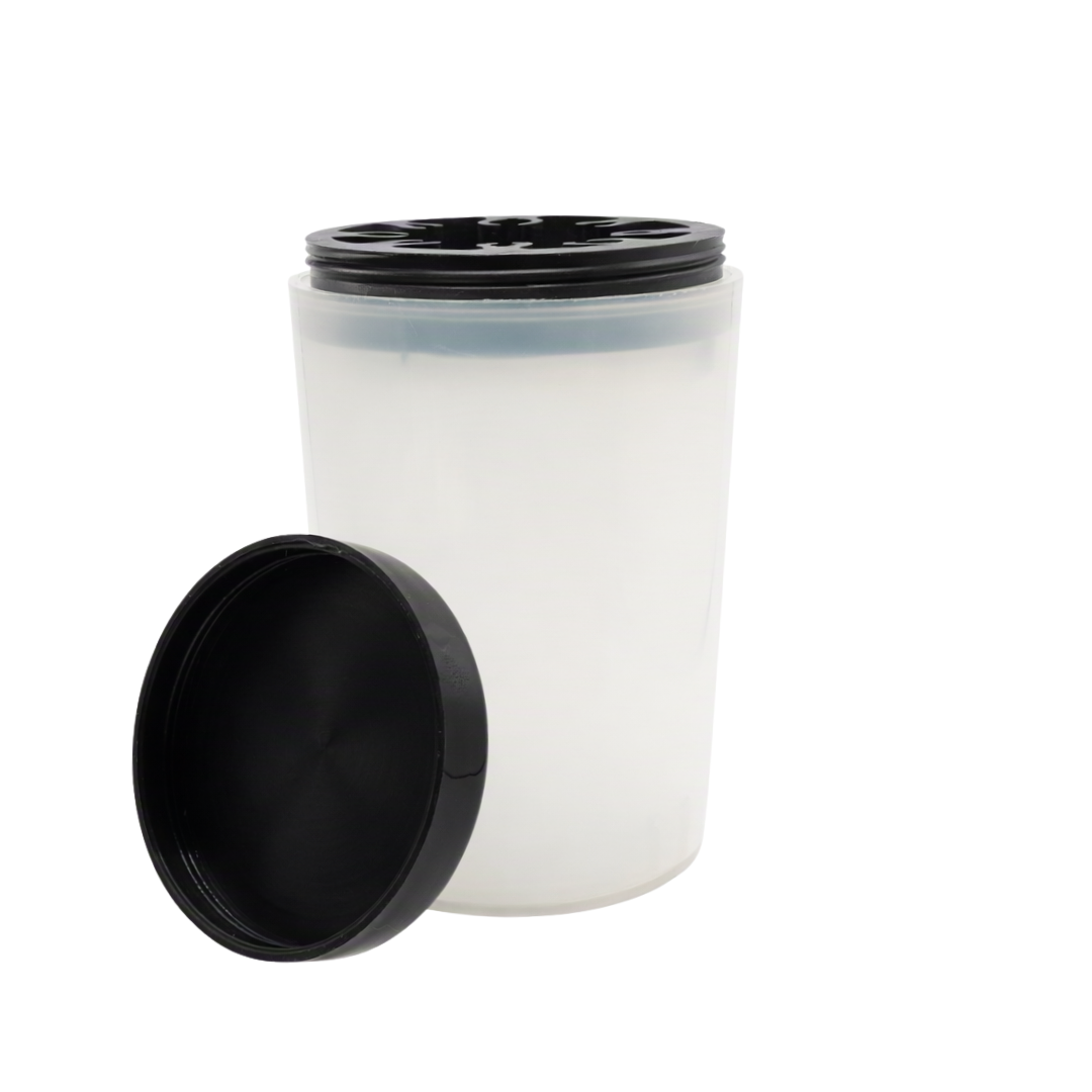 A translucent white plastic jar with a black screw-on lid, shown with the lid leaning in front on a plain white background.