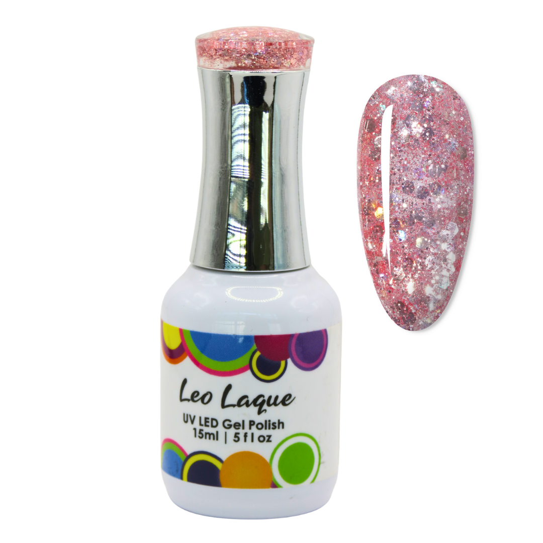 A bottle of Leo Laque UV LED gel polish with a silver cap and a white label, shown next to a nail swatch displaying a pink glittery manicure on a white background.