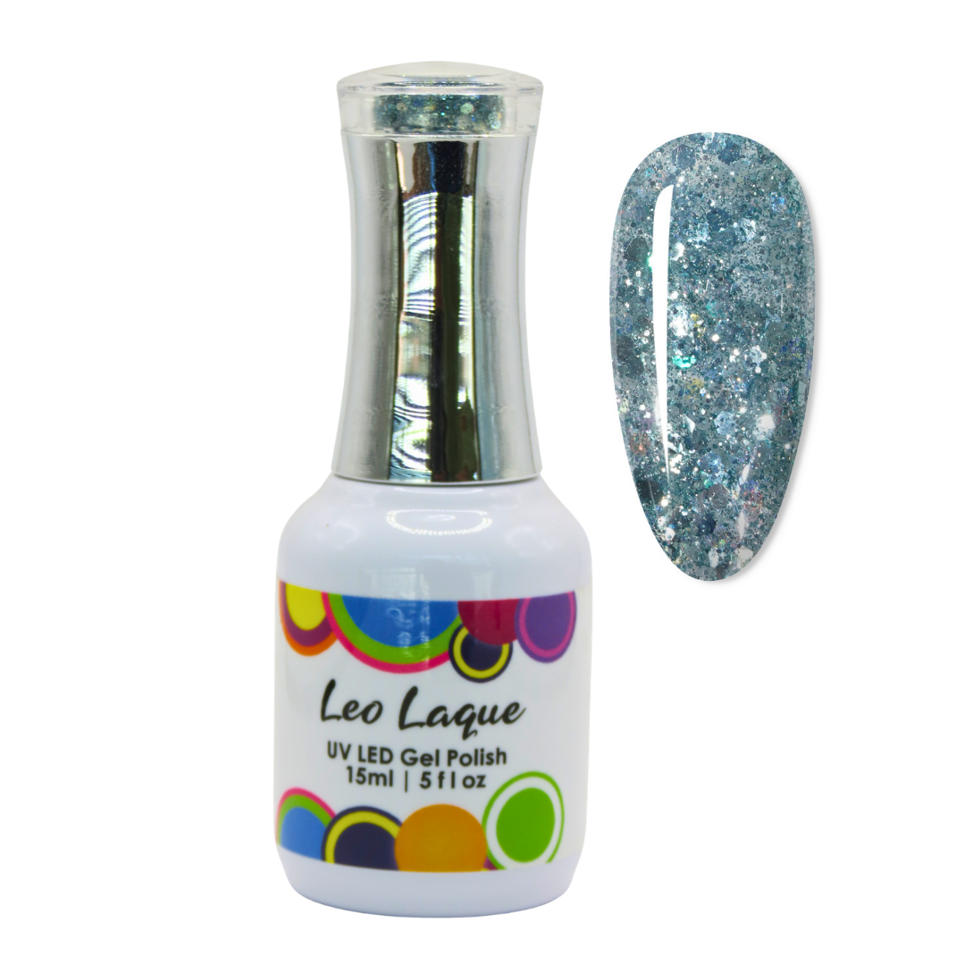 A bottle of Leo Laque UV LED gel polish with a silver cap and a matching glitter swatch showing a light blue and silver glitter manicure on a white background.