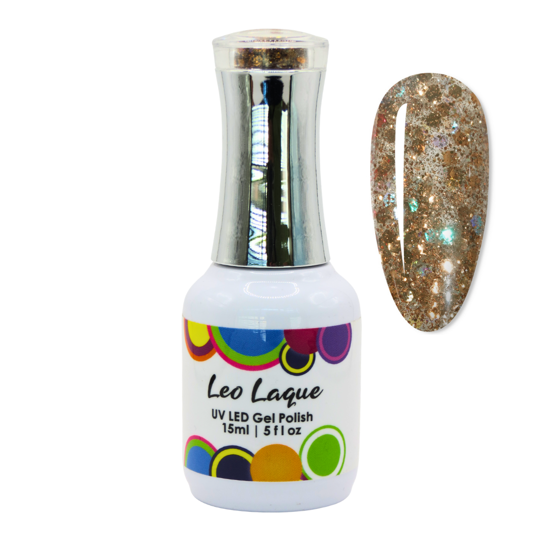 A bottle of Leo Laque UV LED gel nail polish with a silver cap and a white label, shown next to a nail swatch displaying a glittery gold, bronze, and holographic finish.