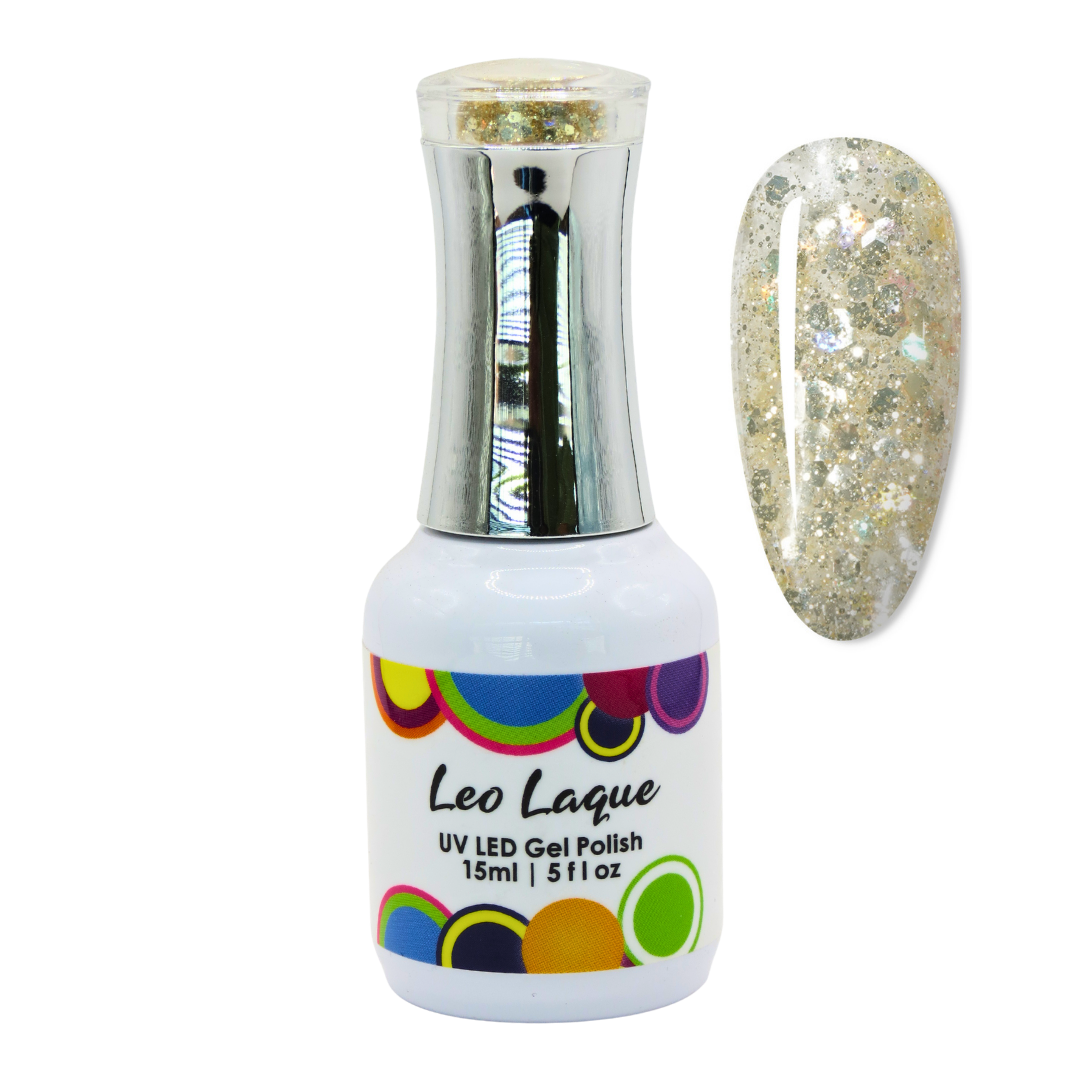 A bottle of Leo Laque UV LED gel nail polish with gold glitter, shown next to a nail tip swatch displaying the glittery gold finish.