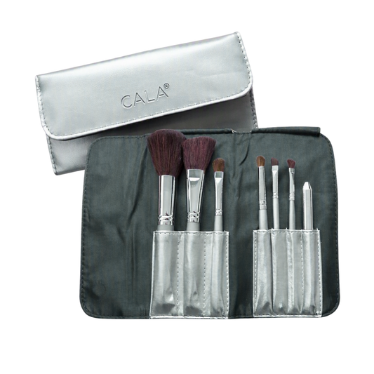 A makeup brush set with six brushes in a dark gray roll-up case, shown alongside its metallic silver zippered carrying pouch. The pouch features the brand name 'CALA' printed on it.