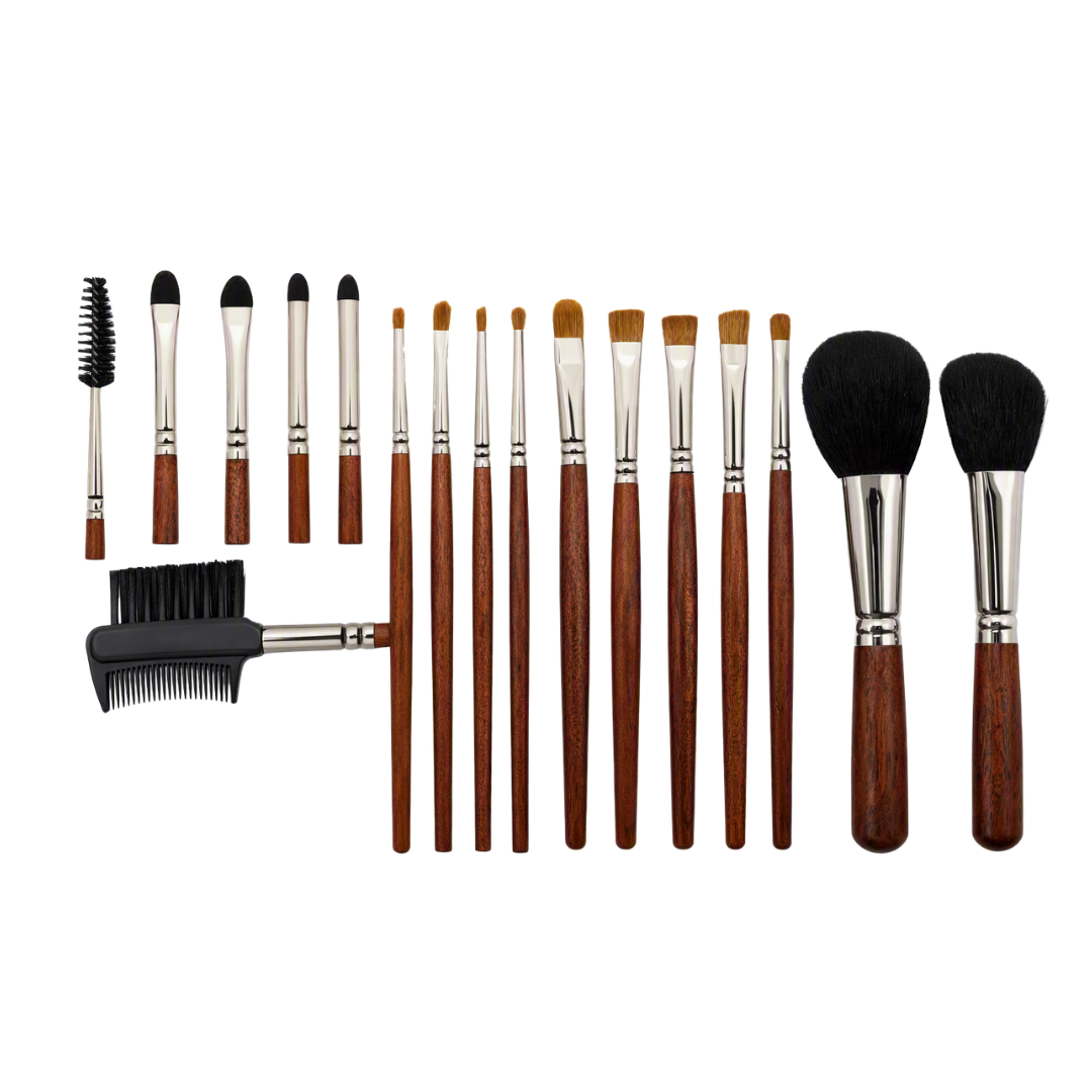 A 15-piece makeup brush set with brown wooden handles, silver ferrules, and black bristles, including face brushes, eye brushes, a brow comb, and an eyebrow pomade brush, arranged on a white background.