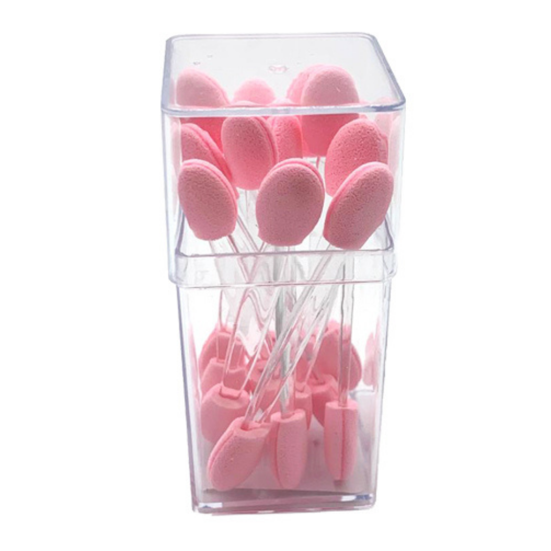 Pink makeup sponge tips organized inside a clear plastic storage container, shown on a plain white background.