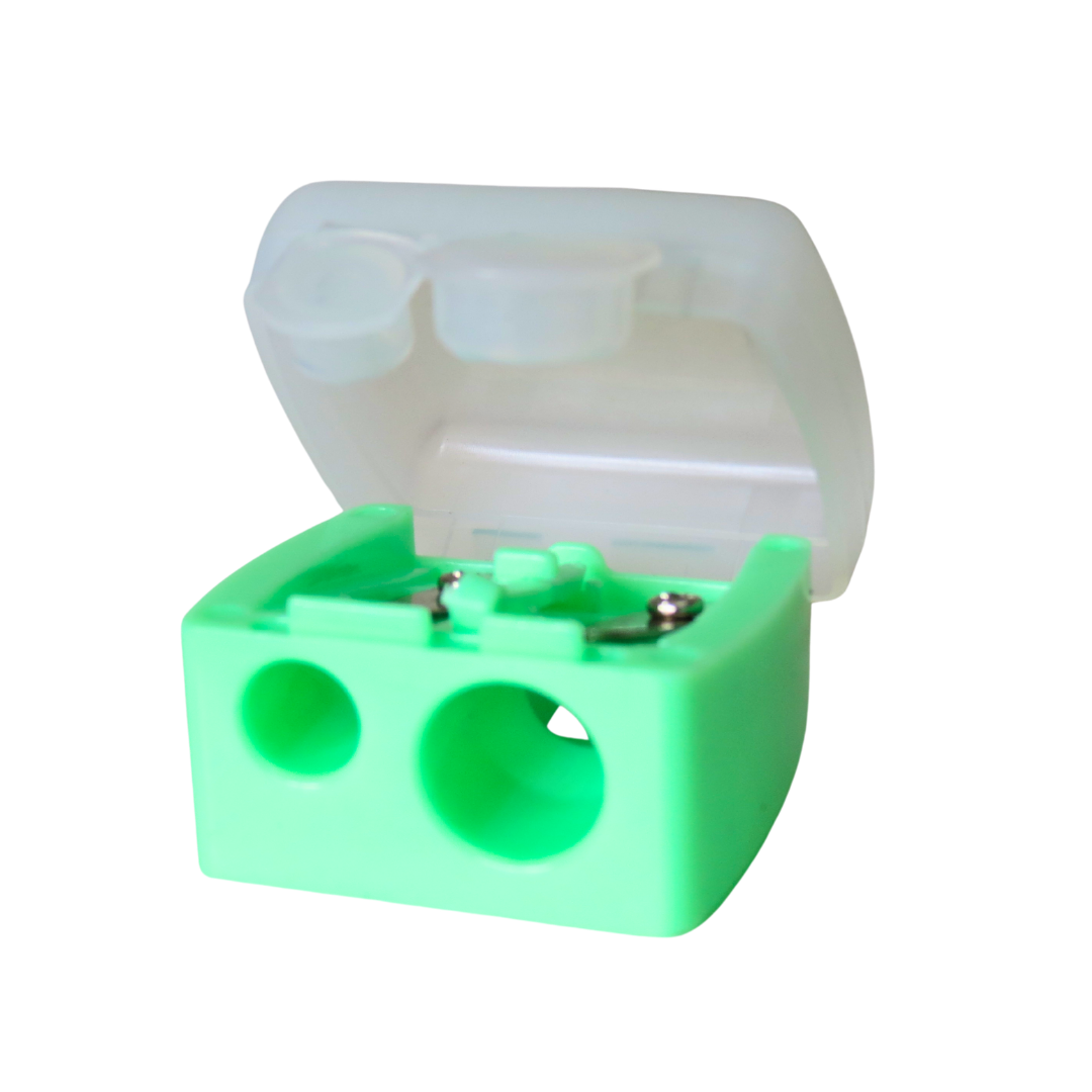 A mint green plastic double-hole pencil sharpener with an open translucent white plastic lid, shown on a solid white background.