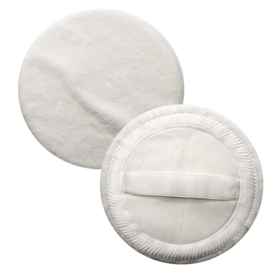 Two round white makeup sponges, one showing the soft textured front side and the other showing the stitched back with a central strap, on a plain white background.