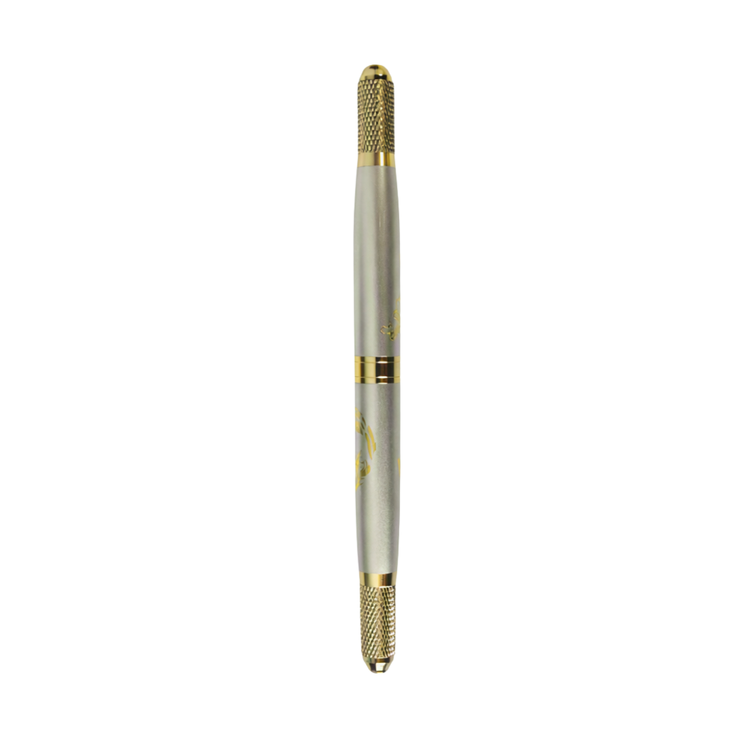 A gold dual sided micro-blading tool on a white background