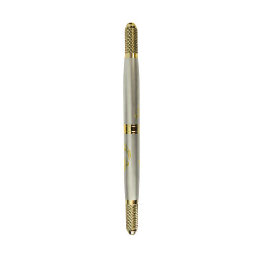 A gold dual sided micro-blading tool on a white background