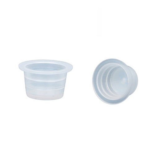 Plastic small pigment ink cup side view and one laying on side to view inner area