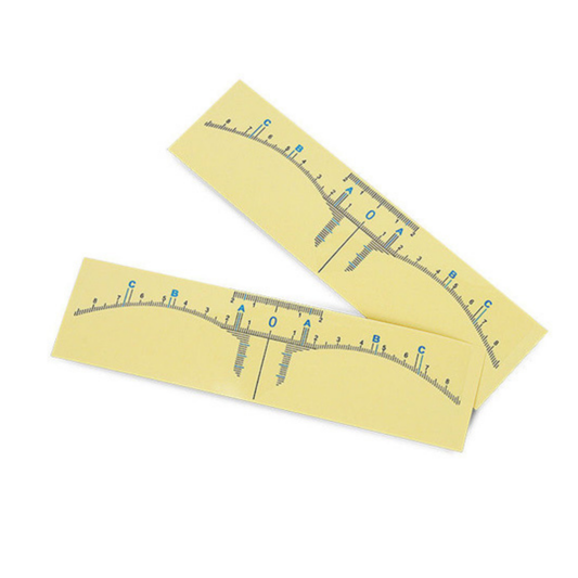 Two pale yellow rectangular paper strips with printed measurement markings and letters, shown on a plain white background.