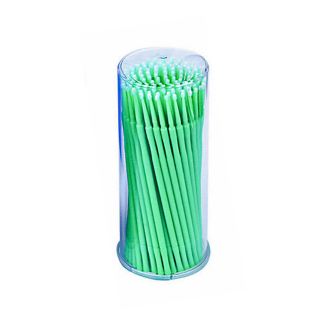 A clear cylindrical plastic container filled with bright green fine micro brushes, shown on a plain white background.