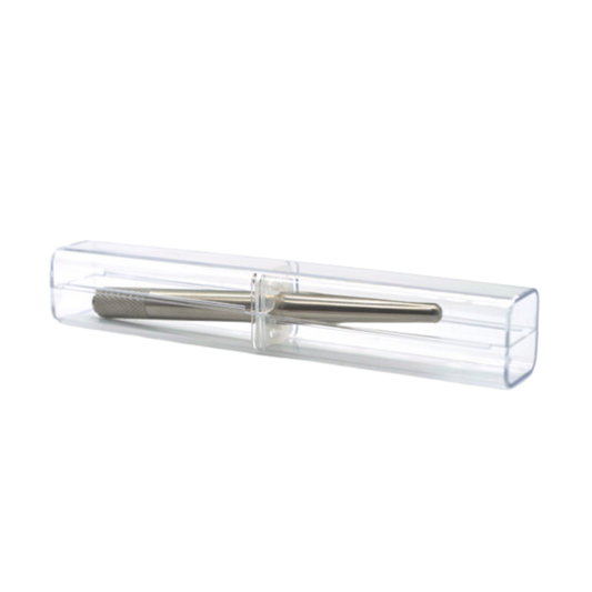 A silver metal microblading tool enclosed in a clear plastic protective case, shown against a plain white background.