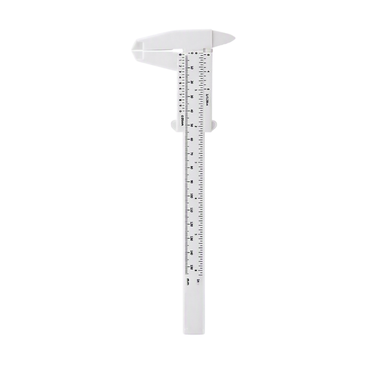 A white caliper with black measurement markings for eyebrow mapping, shown vertically on a plain white background.