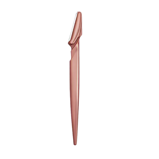 A rose gold eyebrow razor on a white background