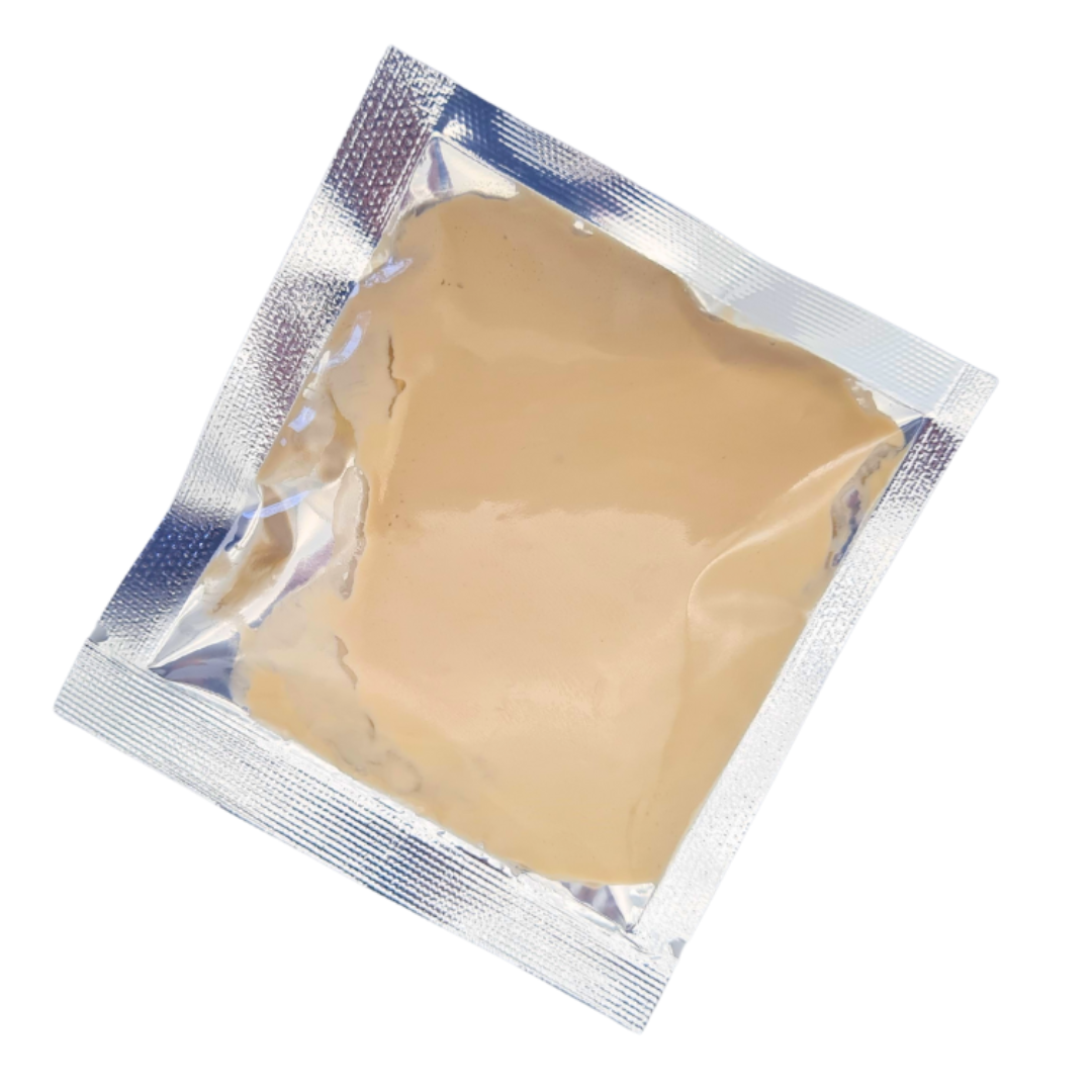 Beige Full body immune boost mask sealed in a silver foil packet, shown on a plain white background.