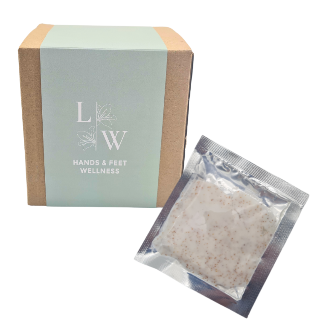 A set of foot scrub products from Leo Wellness, including a small box with green wrap and a sachet of peppermint foot scrub .