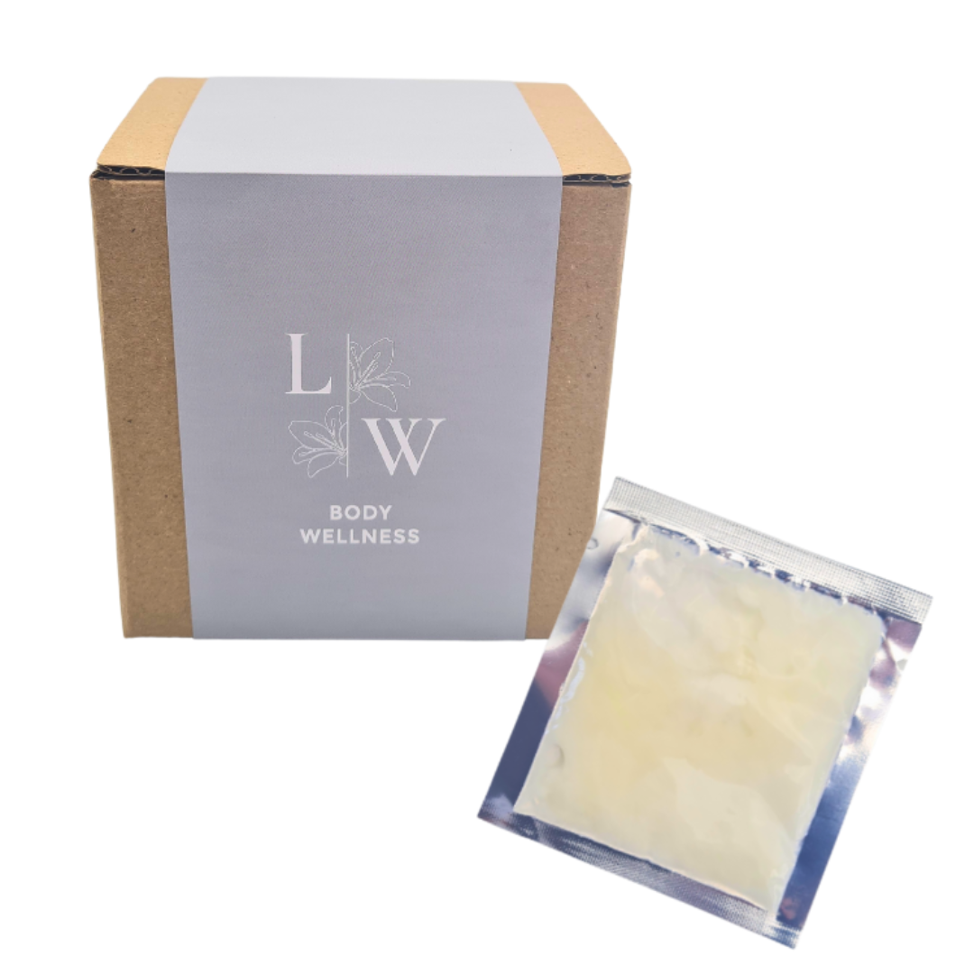 A kraft paper box with a gray paper band labeled 'LW BODY WELLNESS' next to a small silver foil packet containing pale yellow pregnancy safe massage balm, on a white background.