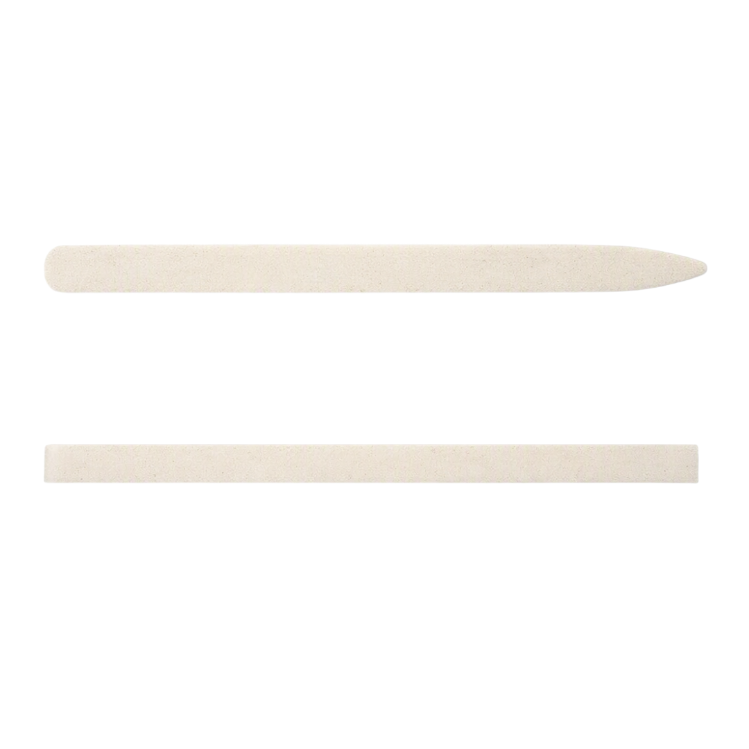 Two light beige long thin ceramic stone for undernail cleaning, one pointed and one flat, shown horizontally on a plain white background.