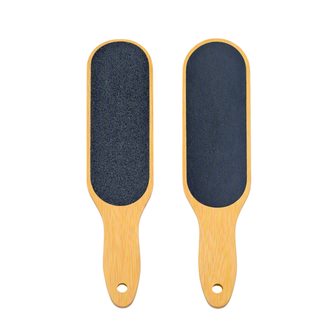 Two wooden foot files with dark gray textured scrubbing grit pads, shown side by side on a plain white background.