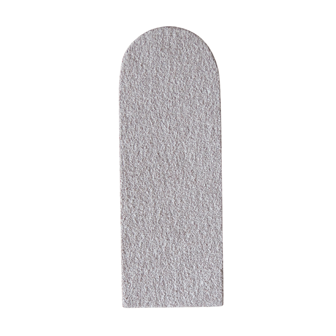Disposable grey grit pad for stainless steel foot file on a white background