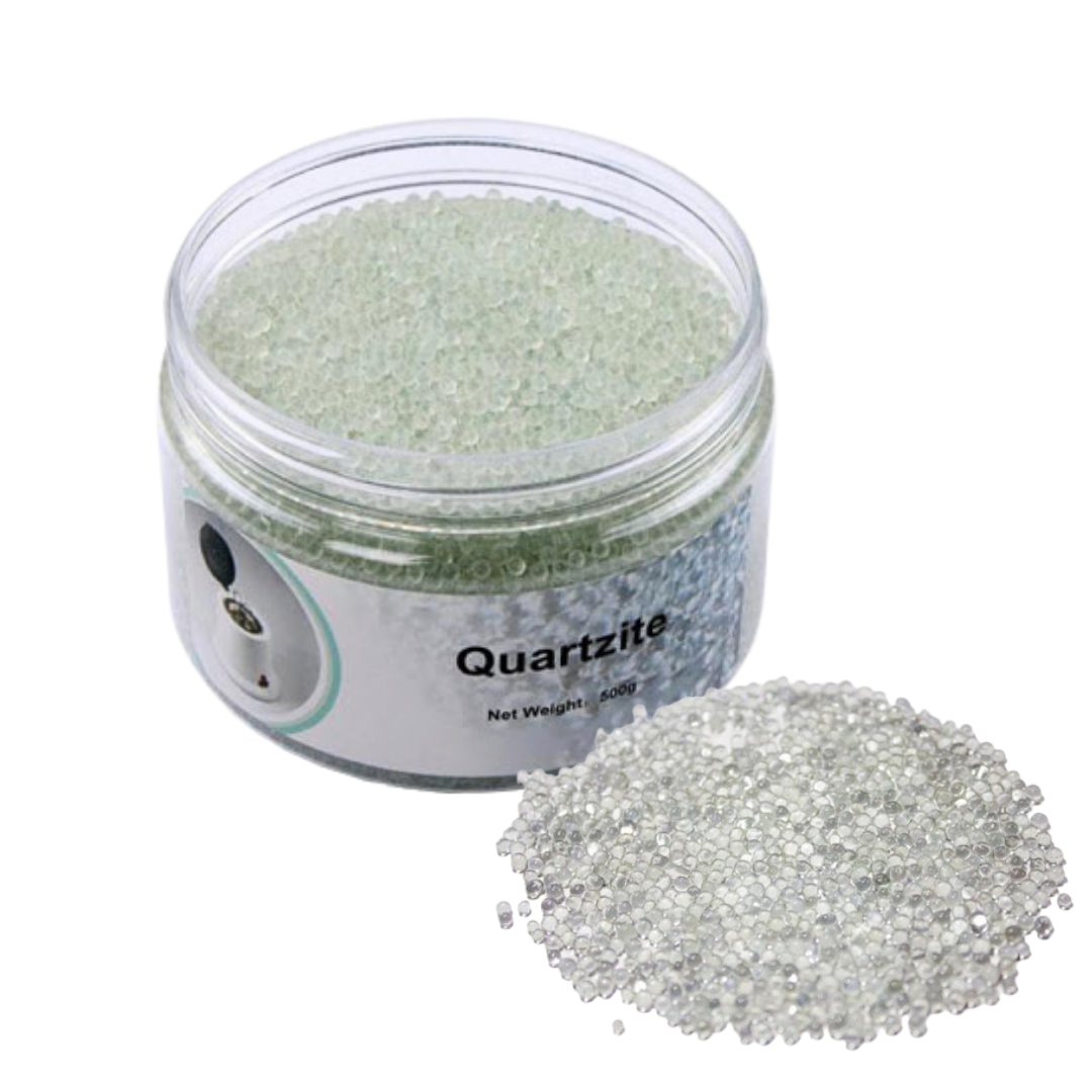 A clear plastic jar filled with pale green quartzite beads, shown next to a small pile of clear quartzite beads on a white background.
