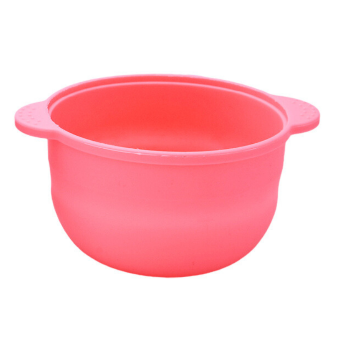 A bright pink silicone 500ml wax melting bowl with integrated side handles, shown against a plain white background.