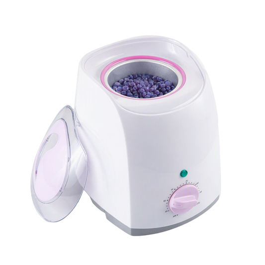A white waxing warmer with a pink control dial and a clear lid, shown on a white background with wax beads visible in the container.