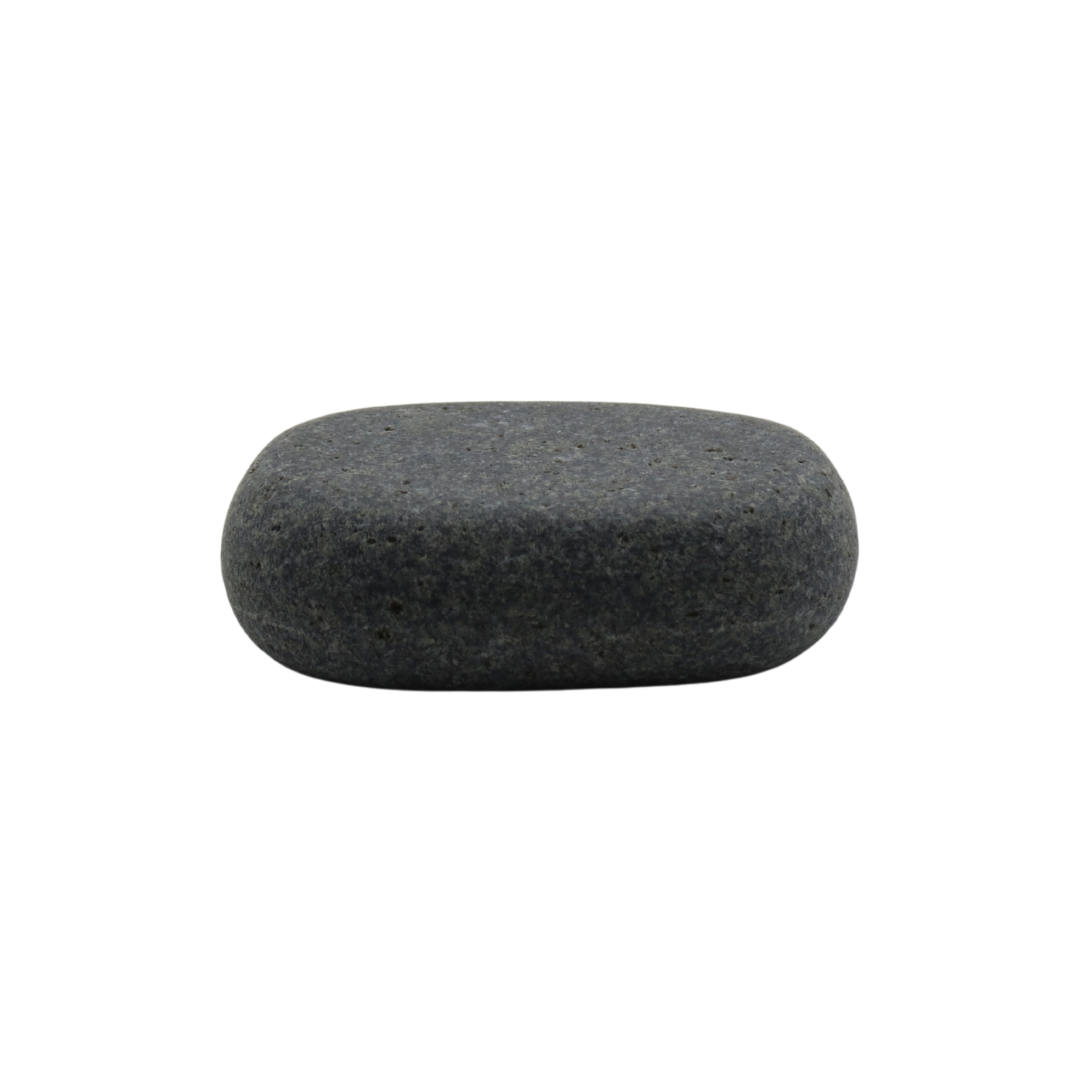 A single smooth rounded dark gray spa massage stone against a plain white background.