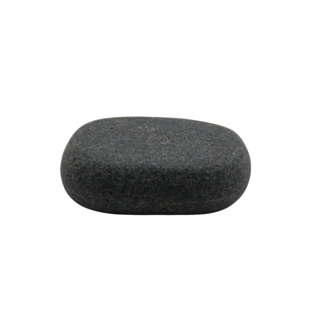 A single smooth rounded dark gray spa massage stone against a plain white background.
