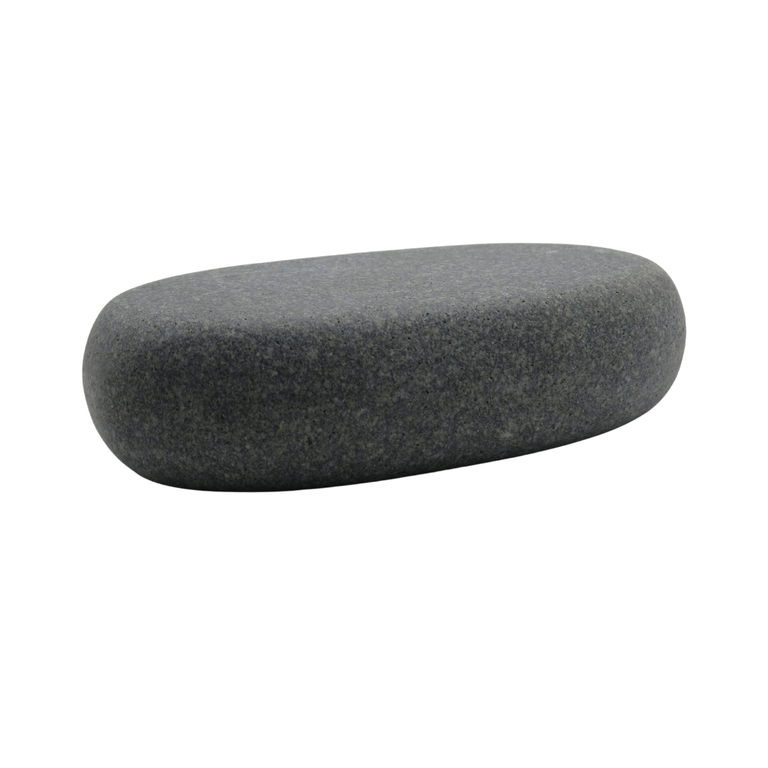 A grey to black placement spa massage stone on white background