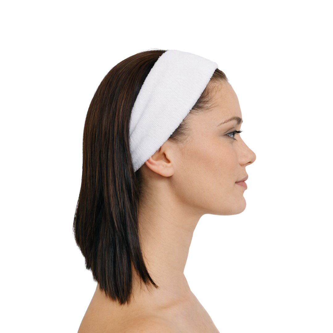 A woman shown in side profile wearing a white textured fabric headband against a plain white background.