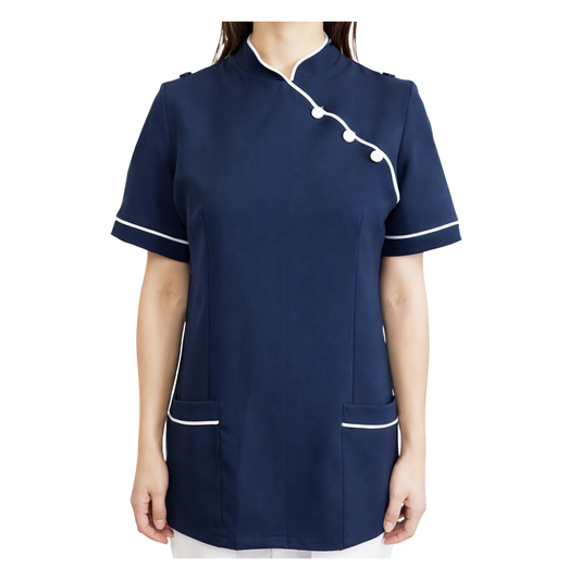 A navy blue short-sleeve medical scrub top with white piping and button details, shown on a model against a white background.