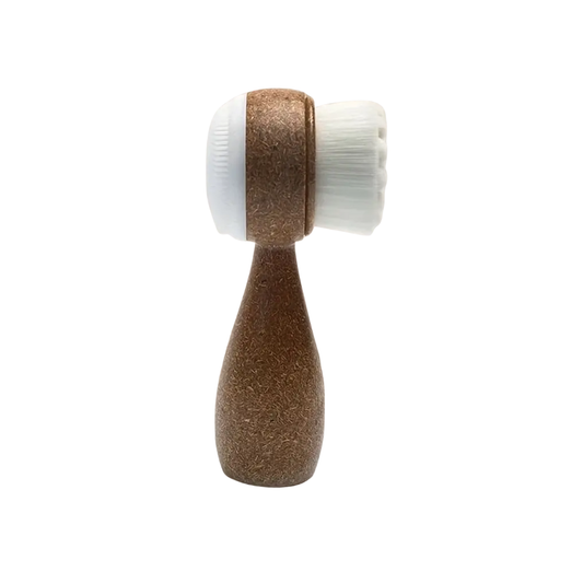 SKN153 Sknlogic Coconut Facial Brush | Facial cleansing brush with wooden handle and white bristle head on a white background
