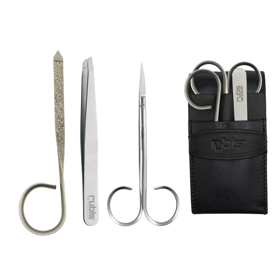 A Rubis set of three silver metal nail care tools, including a nail file, tweezers, cuticle and nail scissors, displayed next to a black leather carrying pouch on a white background.