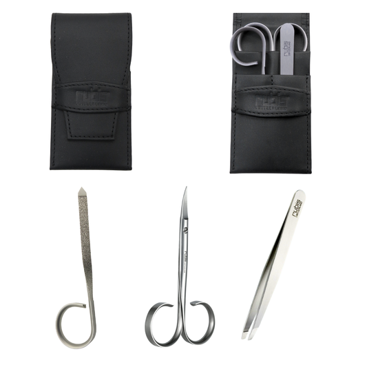 A set of three silver metal beauty tools with black leather storage pouches on a white background. The tools include a curved nail file, small manicure scissors, and tweezers, all branded with the Rubis logo.