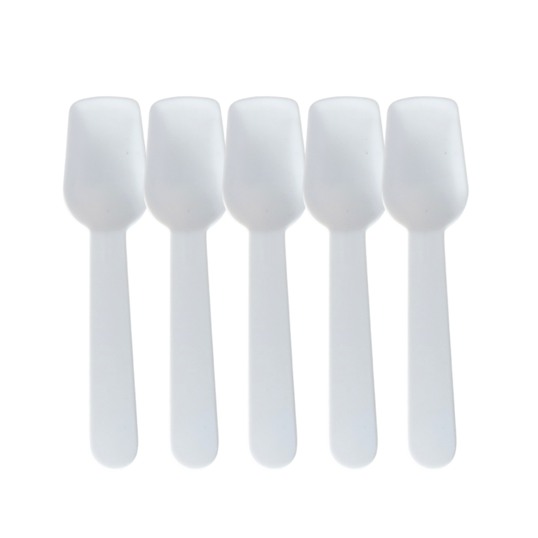 Five white plastic spoon spatulas arranged in a row on a plain white background.