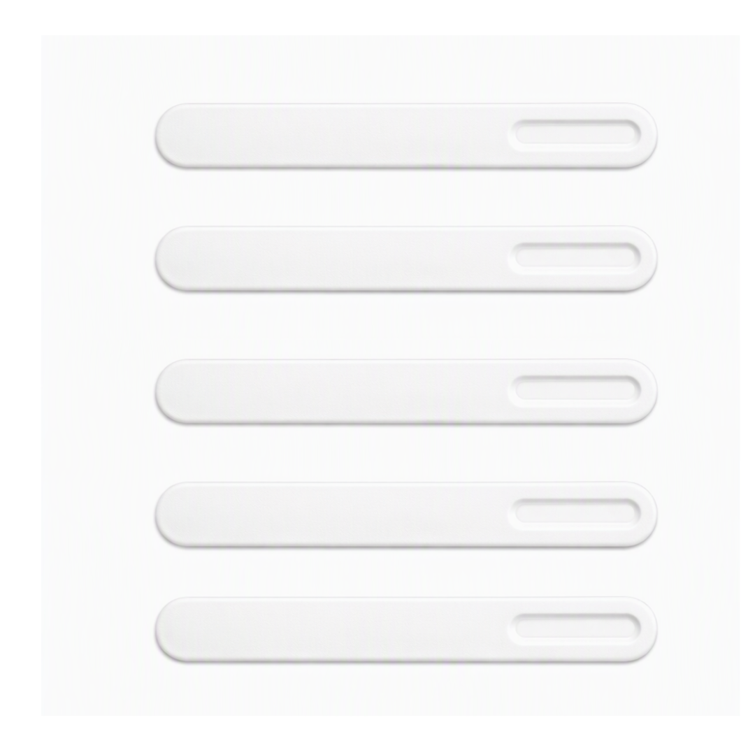 Five White plastic spatulas on a white background