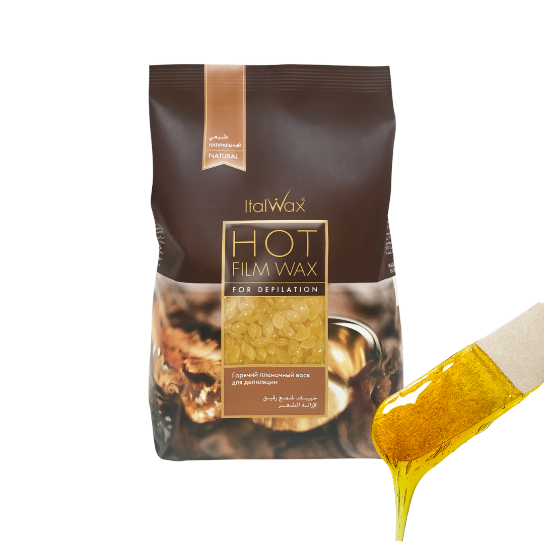 W310 Italwax Natural Pine Film Wax | A bag of Italwax Honey Hot Film Wax for depilatory use, shown on a white background with a golden wax smear dripping from the lower right corner.