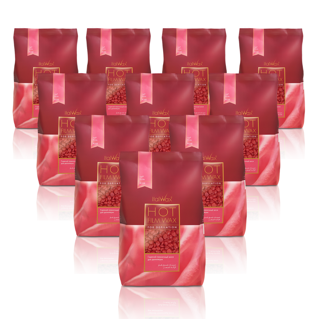 W311B Italwax 10 x 1kg Rose Film Wax | A collection of bright pink Italwax Azulene film wax, for professional hair removal on underarms and bikini, in a light and bright pink branded Italwax plastic bag with pink wax beads showing